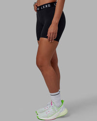 Woman wearing Extend Mid-Rise 6" Short - Black-White