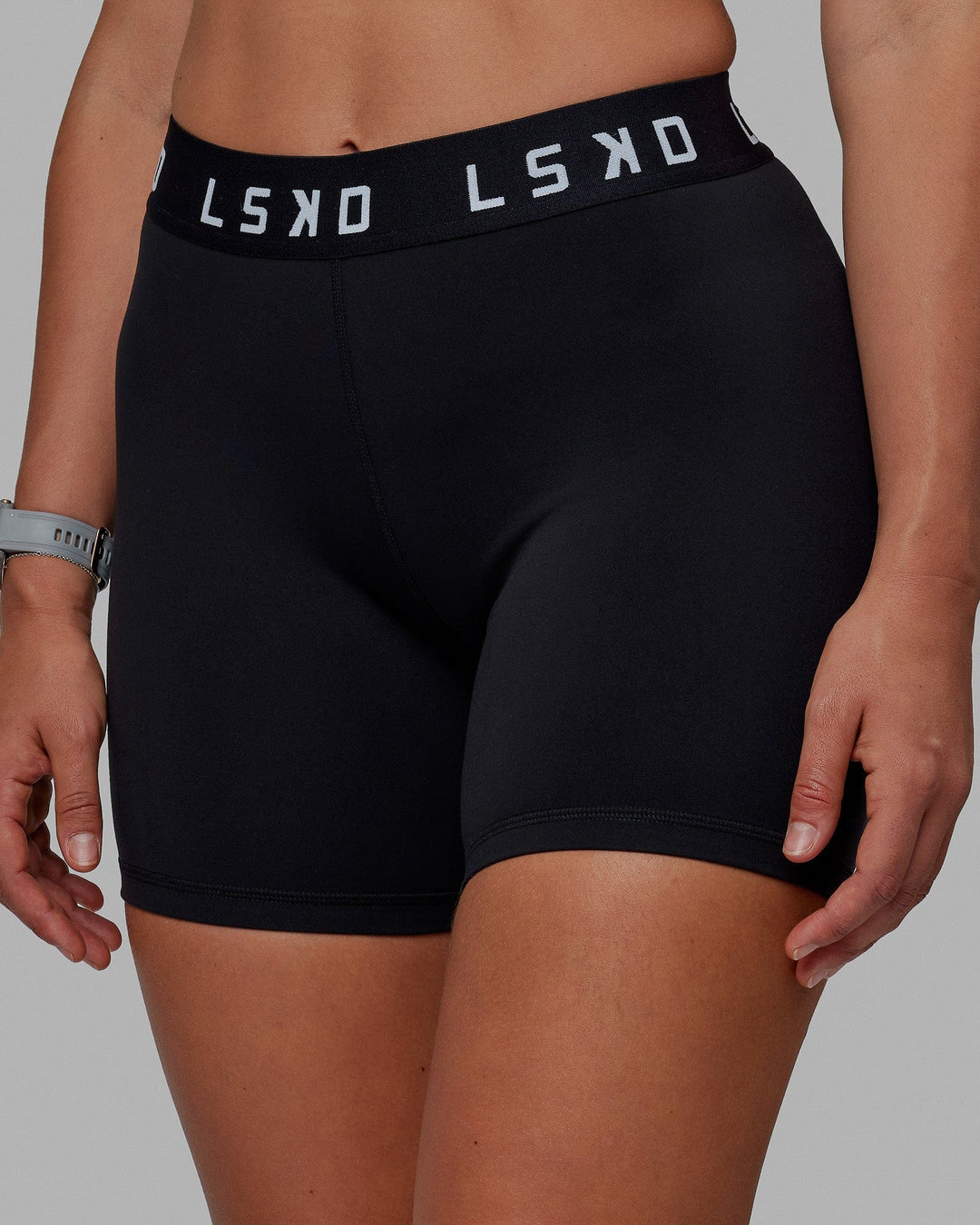 Woman wearing Extend Mid-Rise 6&quot; Short - Black-White