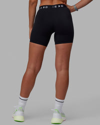 Woman wearing Extend Mid-Rise 6" Short - Black-White