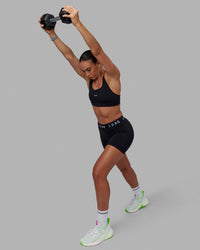 Woman wearing Extend Mid-Rise 6" Short - Black-White