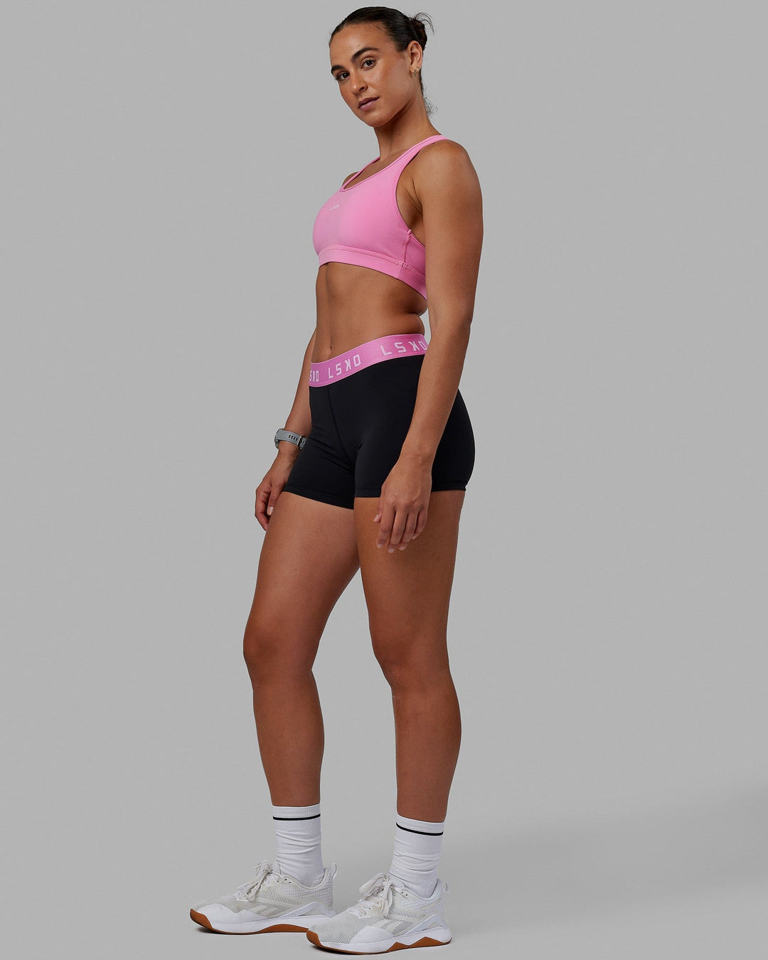 Woman wearing Extend Sports Bra - Spark Pink