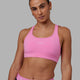 Woman wearing Extend Sports Bra - Spark Pink
