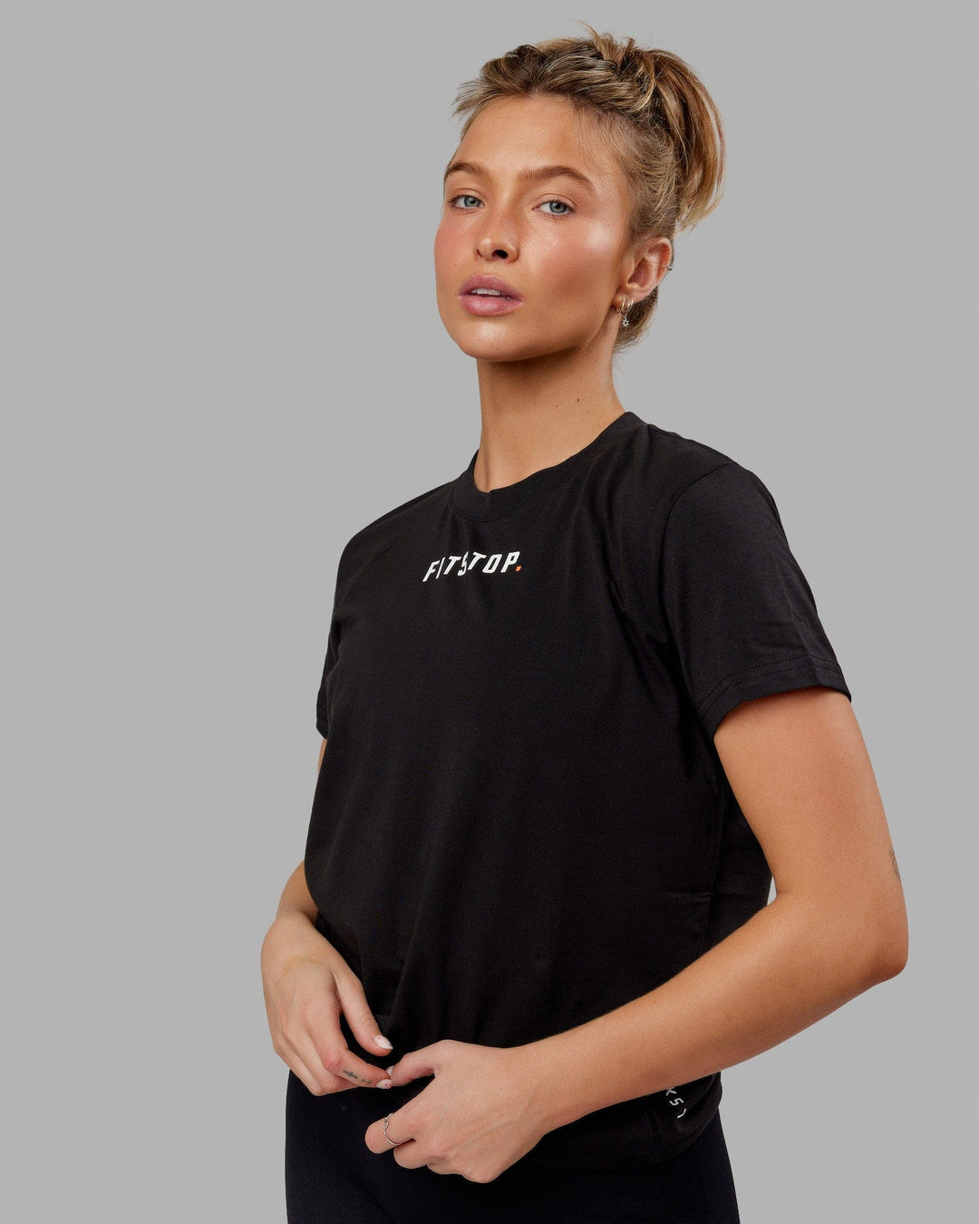 Woman wearing Fitstop Fast Tee - Black