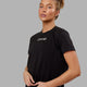 Woman wearing Fitstop Fast Tee - Black