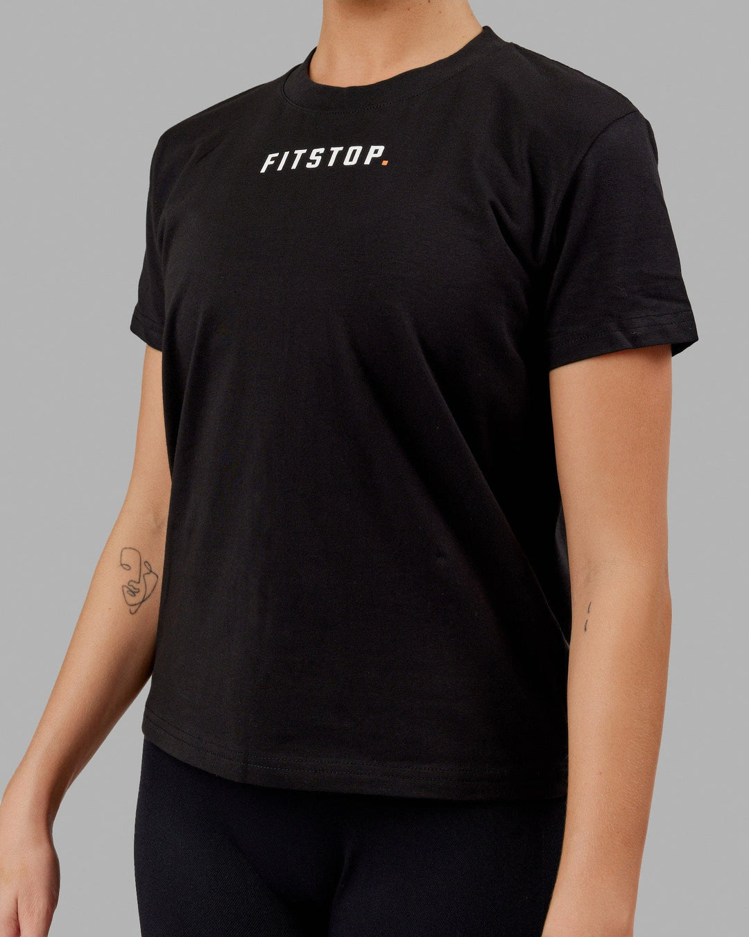 Woman wearing Fitstop Fast Tee - Black