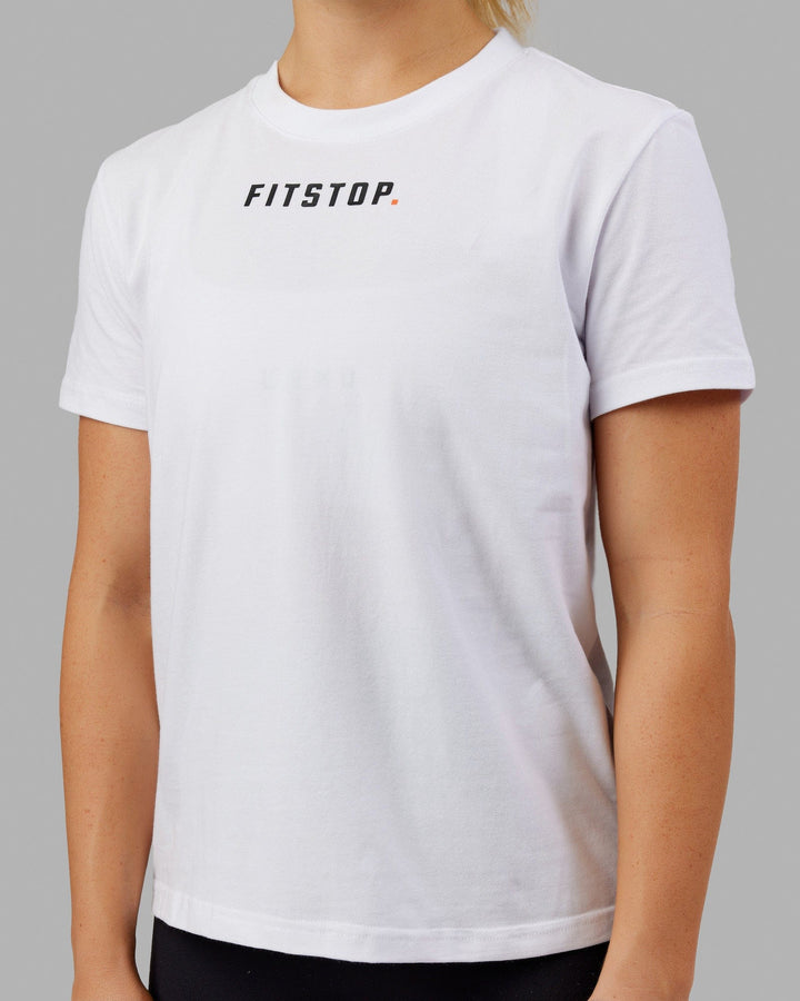 Woman wearing Fitstop Fast Tee - White