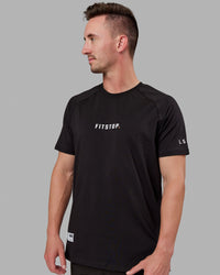 Man wearing Fitstop Optimal Tee - Black
