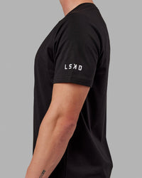 Man wearing Fitstop Optimal Tee - Black