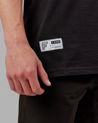 Man wearing Fitstop Optimal Tee - Black