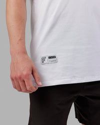 Man wearing Fitstop Optimal Tee - White