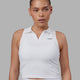 Woman wearing Fairway Collared Tank - White