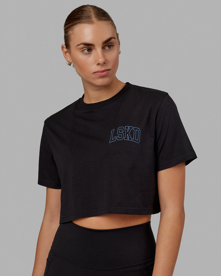 Woman wearing Finish Line Cropped Tee - Black-Power Cobalt