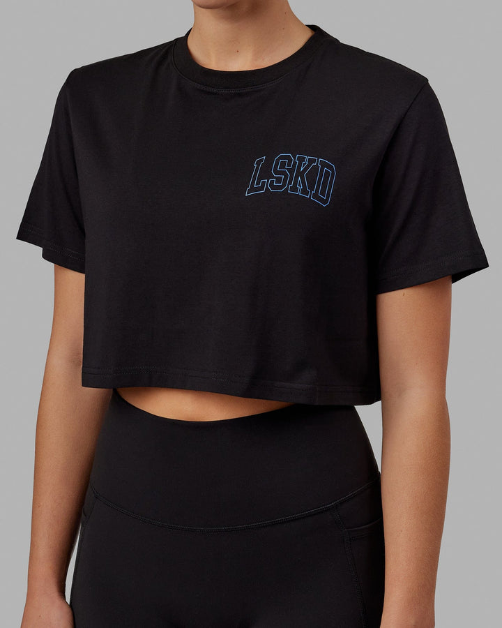 Woman wearing Finish Line Cropped Tee - Black-Power Cobalt