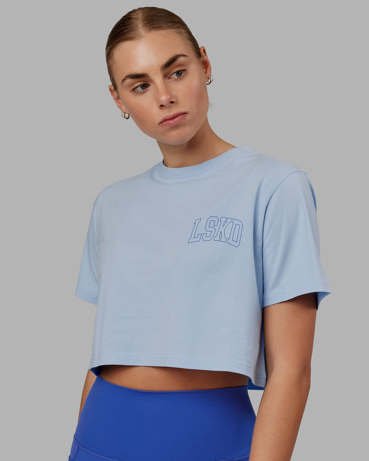 Woman wearing Finish Line Cropped Tee - Windsurfer-Power Cobalt
