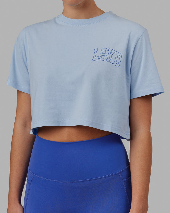 Woman wearing Finish Line Cropped Tee - Windsurfer-Power Cobalt