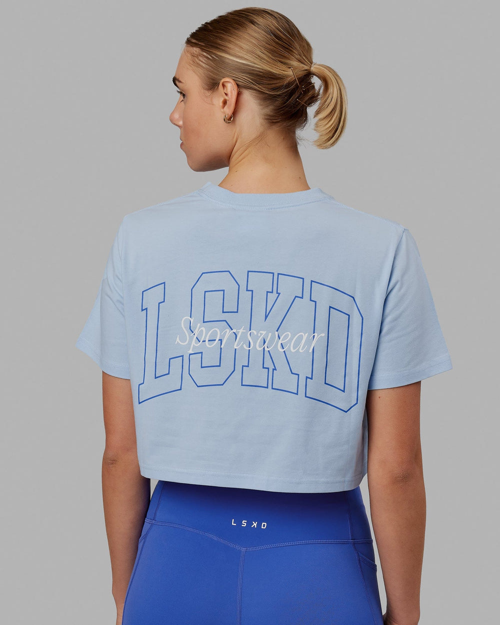 Woman wearing Finish Line Cropped Tee - Windsurfer-Power Cobalt