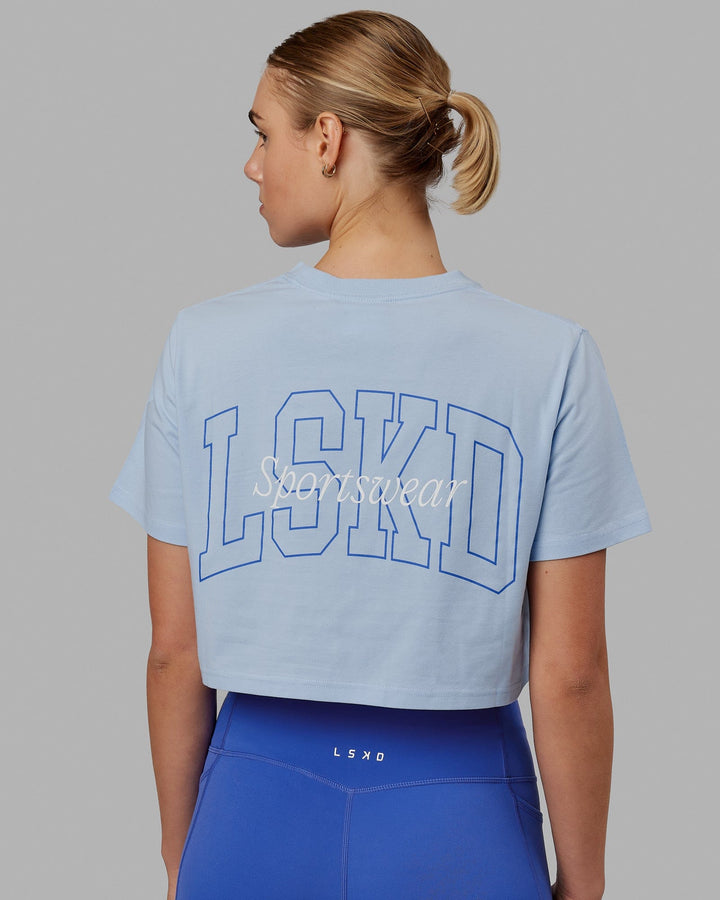 Woman wearing Finish Line Cropped Tee - Windsurfer-Power Cobalt