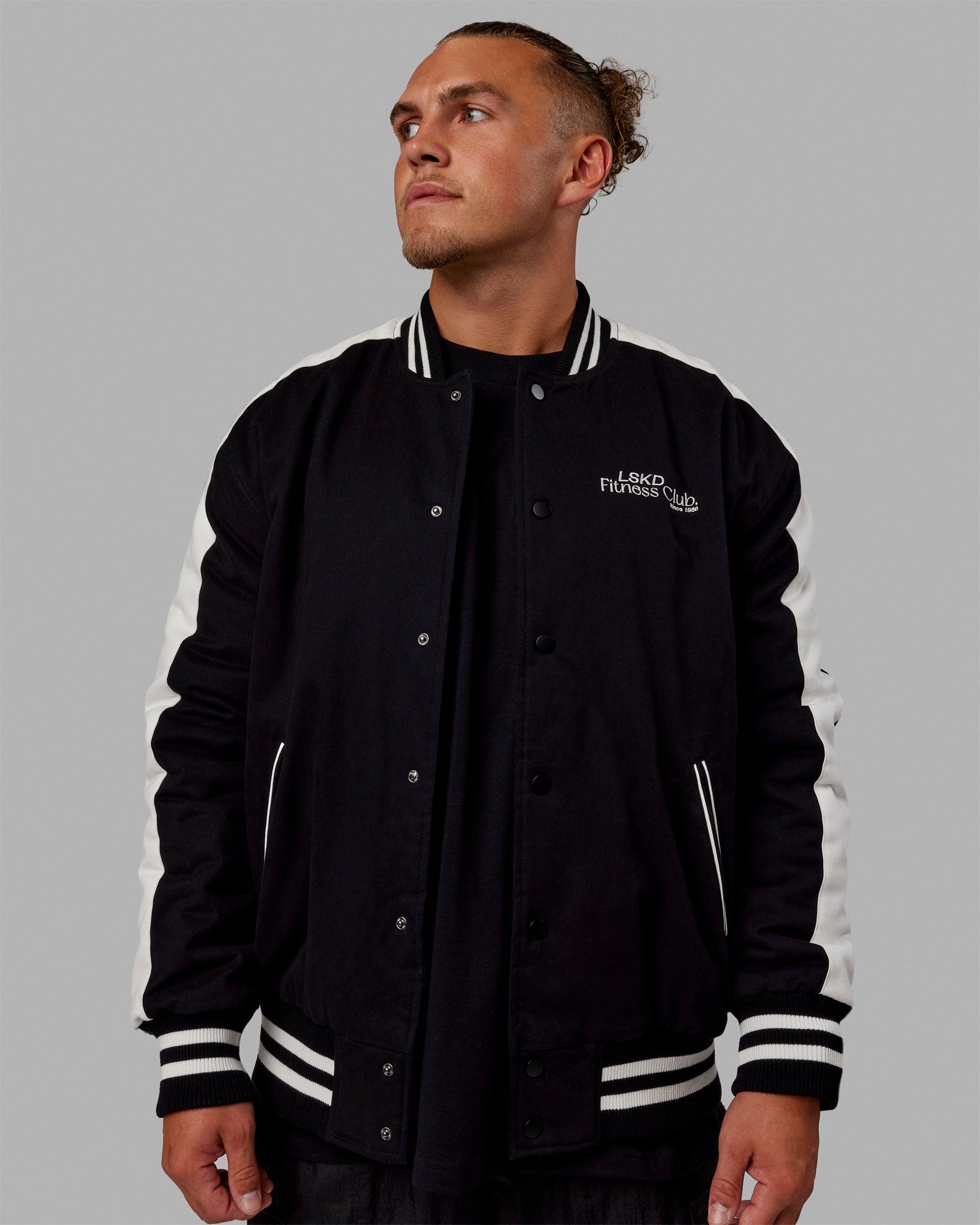 Man wearing Unisex Fitness Club Bomber Jacket - Black-Off White