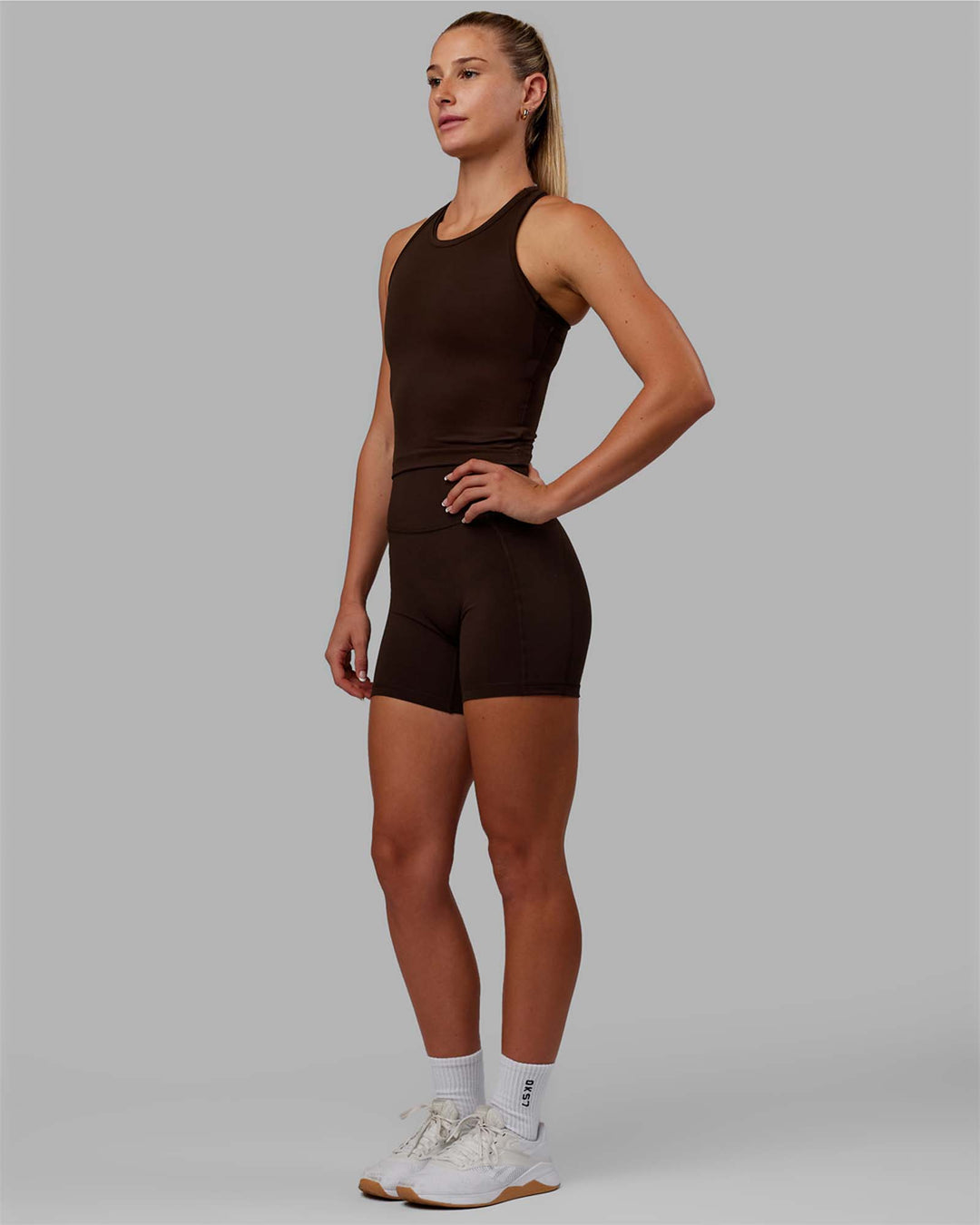Woman wearing Flow Performance Tank - Dark Chocolate