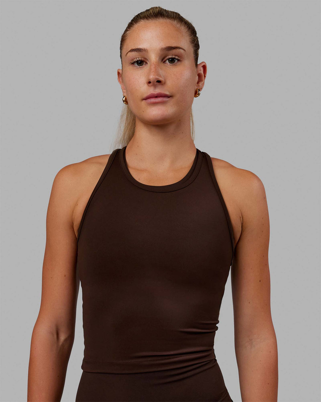 Woman wearing Flow Performance Tank - Dark Chocolate