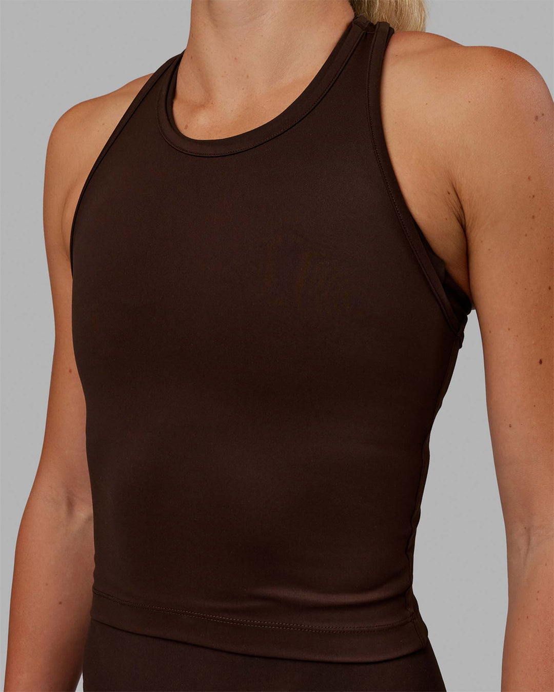 Woman wearing Flow Performance Tank - Dark Chocolate