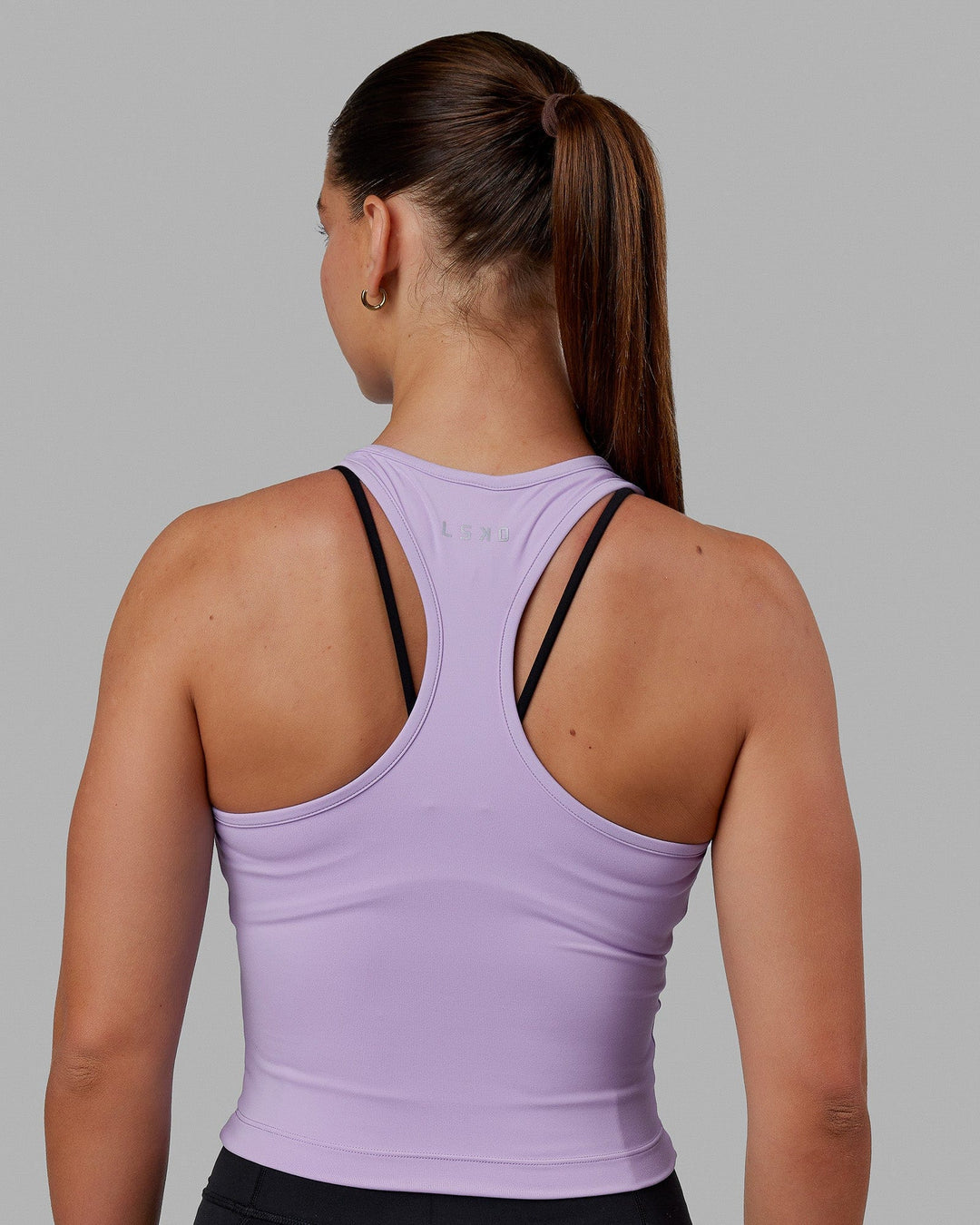 Woman wearing Flow Performance Tank - Pale Lilac