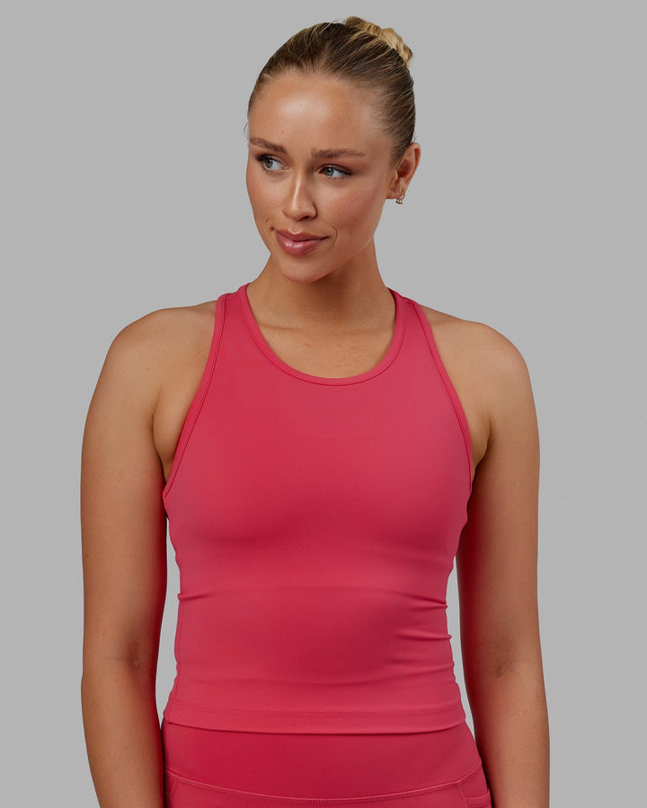 Woman wearing Flow Performance Tank - Raspberry