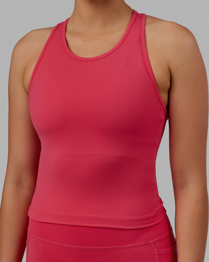 Woman wearing Flow Performance Tank - Raspberry