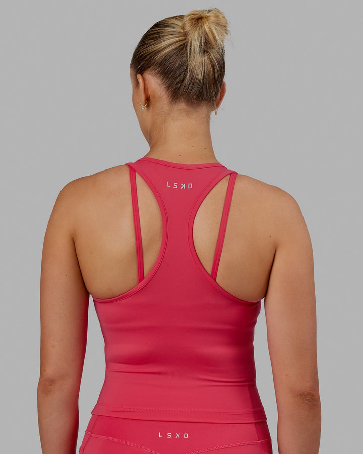Woman wearing Flow Performance Tank - Raspberry