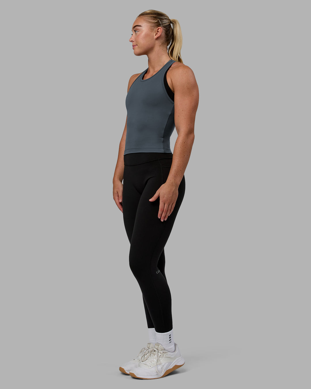 Woman wearing Flow Performance Tank - Turbulence