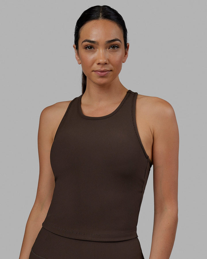 Woman wearing Flow Ribbed Shelf Bra Performance Tank - Dark Chocolate