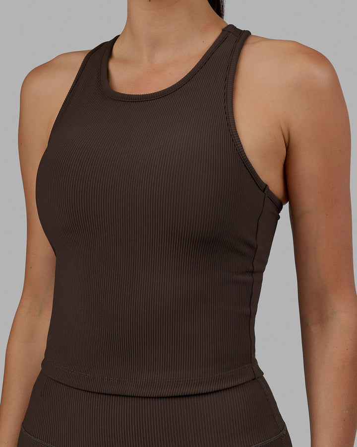 Woman wearing Flow Ribbed Shelf Bra Performance Tank - Dark Chocolate