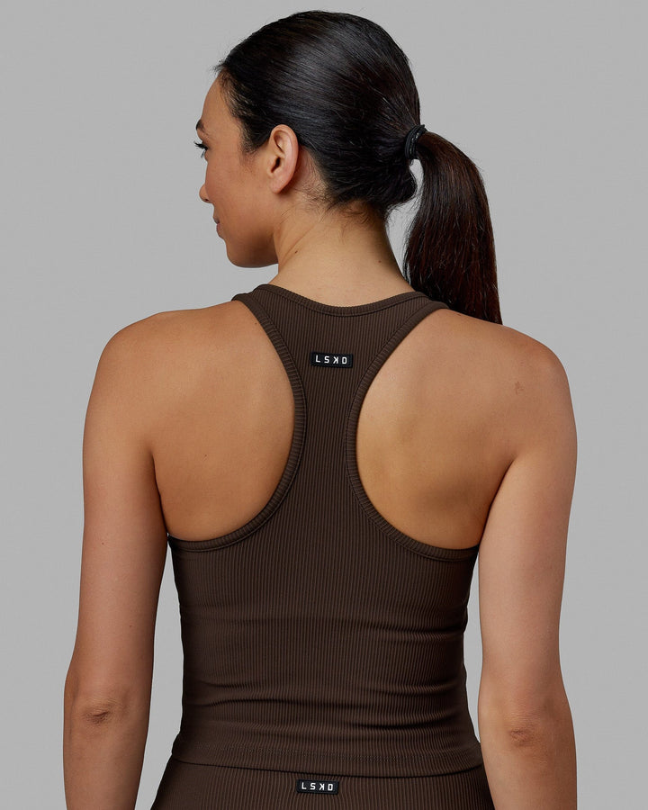 Woman wearing Flow Ribbed Shelf Bra Performance Tank - Dark Chocolate