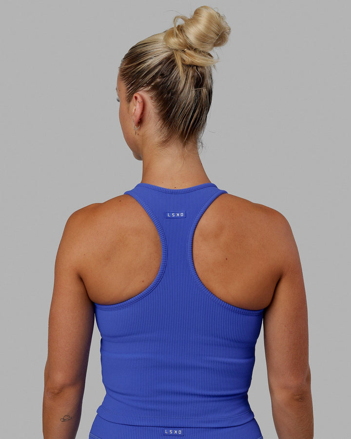 Woman wearing Flow Ribbed Shelf Bra Performance Tank - Power Cobalt