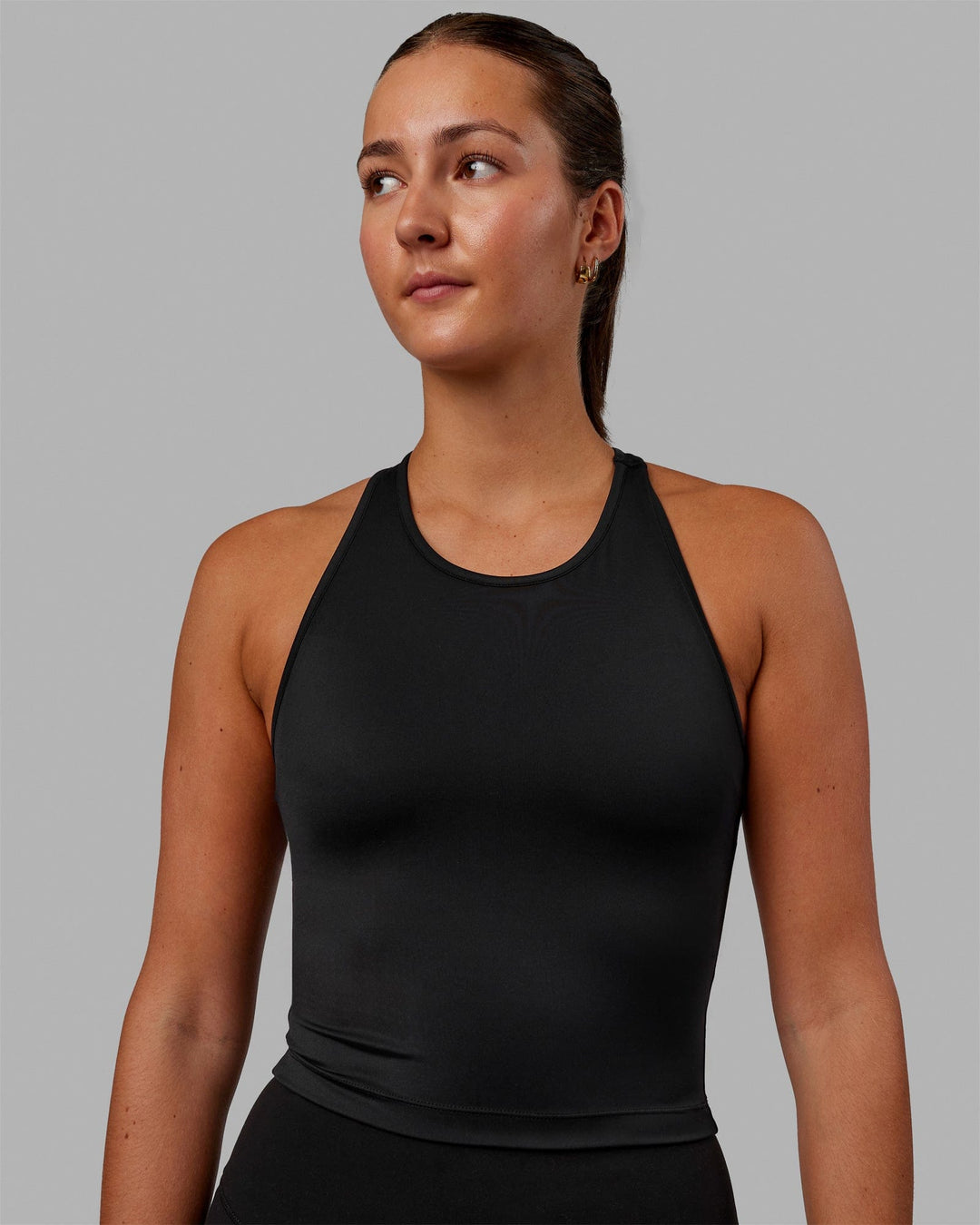 Woman wearing Flow Shelf Bra Performance Tank - Black