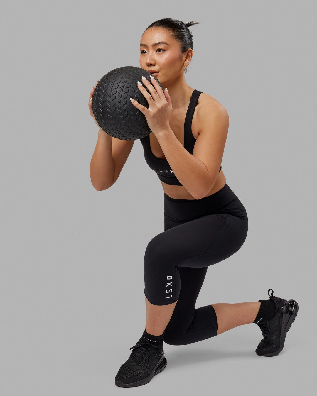 Woman wearing Flux Ultra High-Rise 3/4 Legging Pockets - Black