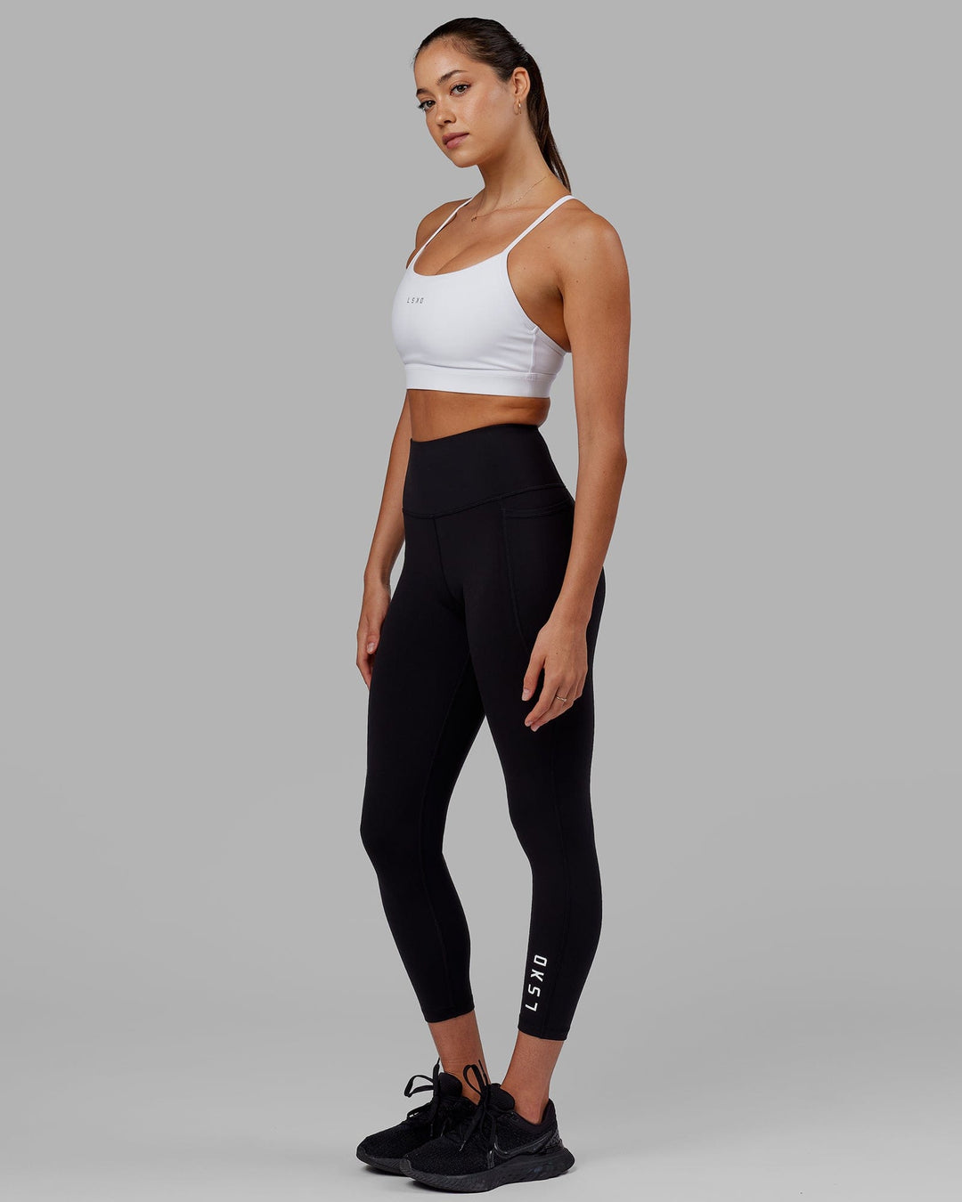 Woman wearing Flux Ultra High-Rise 7/8 Legging Pockets - Black