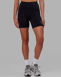 Woman wearing Flux Ultra High-Rise 6" Short Pockets - Black