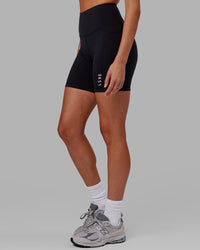 Woman wearing Flux Ultra High-Rise 6" Short Pockets - Black