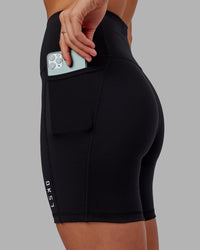 Woman wearing Flux Ultra High-Rise 6" Short Pockets - Black