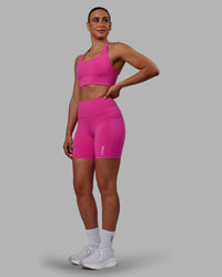 Woman wearing Flux Ultra High-Rise 6" Short Pockets - Fuchsia Pink