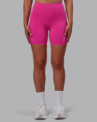 Woman wearing Flux Ultra High-Rise 6" Short Pockets - Fuchsia Pink
