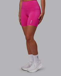 Woman wearing Flux Ultra High-Rise 6" Short Pockets - Fuchsia Pink