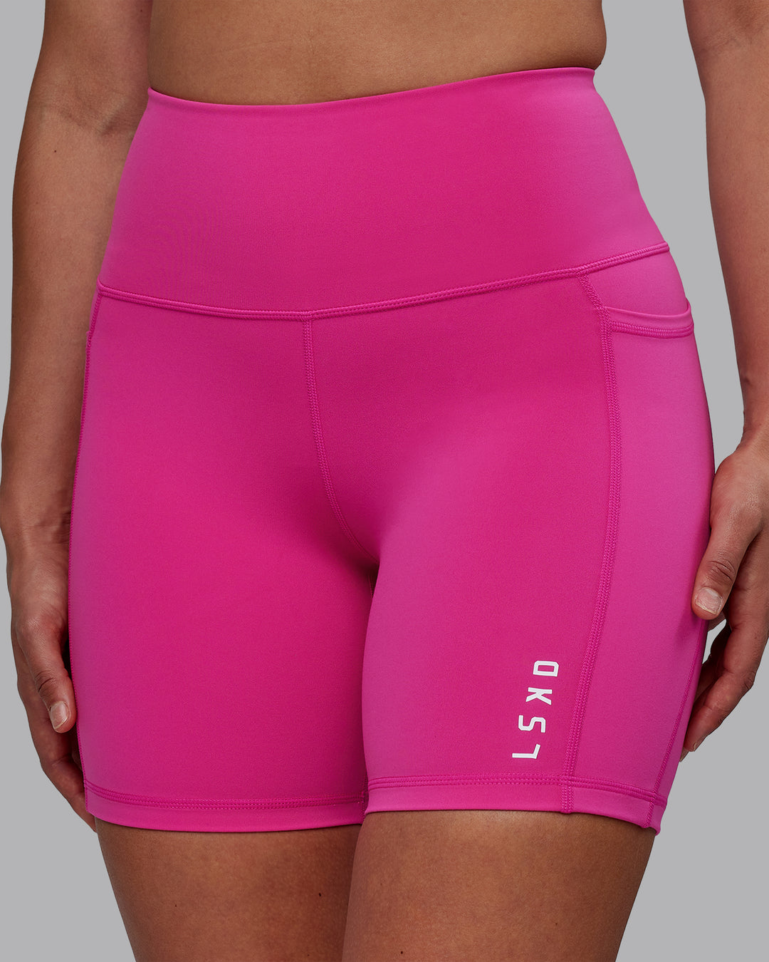 Woman wearing Flux Ultra High-Rise 6" Short Pockets - Fuchsia Pink