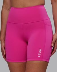 Woman wearing Flux Ultra High-Rise 6" Short Pockets - Fuchsia Pink