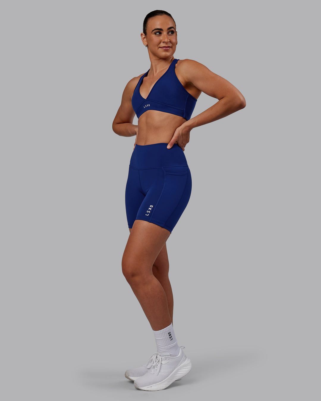 Woman wearing Flux Ultra High-Rise 6&quot; Short Pockets - Midnight Blue