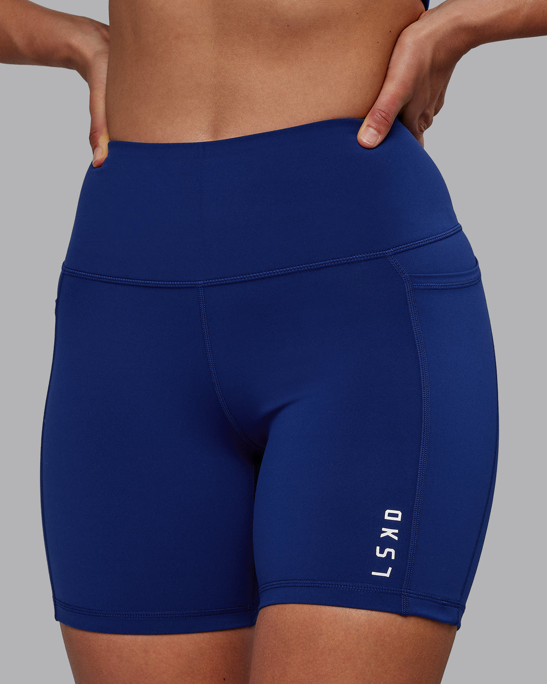 Woman wearing Flux Ultra High-Rise 6&quot; Short Pockets - Midnight Blue