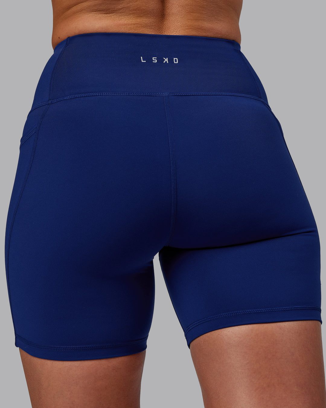Woman wearing Flux Ultra High-Rise 6&quot; Short Pockets - Midnight Blue