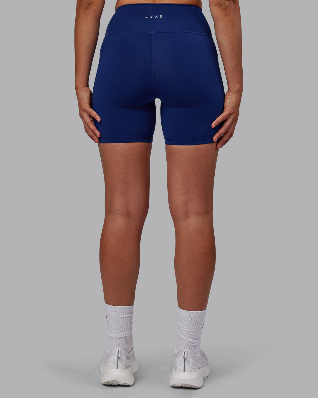 Woman wearing Flux Ultra High-Rise 6&quot; Short Pockets - Midnight Blue