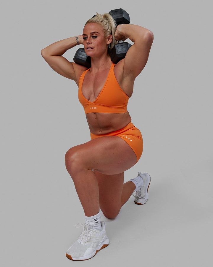 Woman wearing Form Sports Bra - Melon